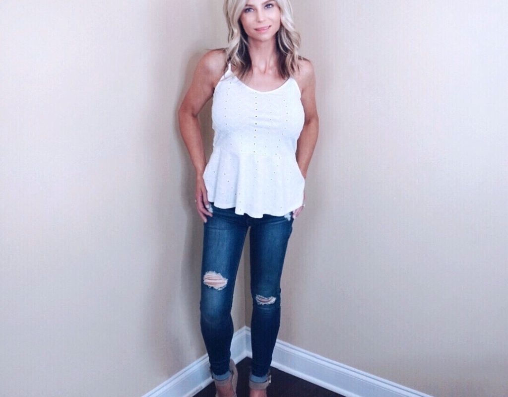 White eyelid tank top and wripped skinny jeans